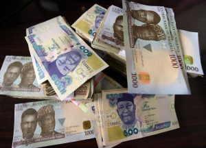 CBN says it is powerless against Nigerians who spray Naira notes at events