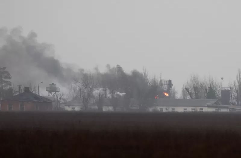 Smoke billows from a military installation near the airport in the southeastern city of Mariupol.