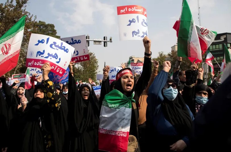 Iranian women chant during a protest condemning the Shiraz attack and unrest in Tehran, Iran