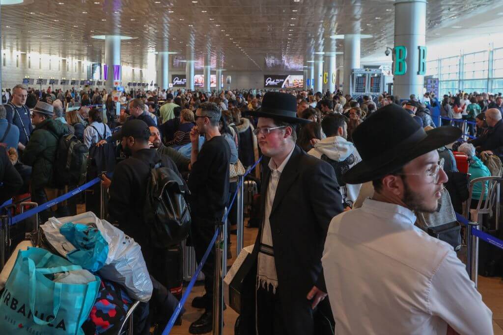 Crowd of people gathered at Ben Gurion Airport to leave the country