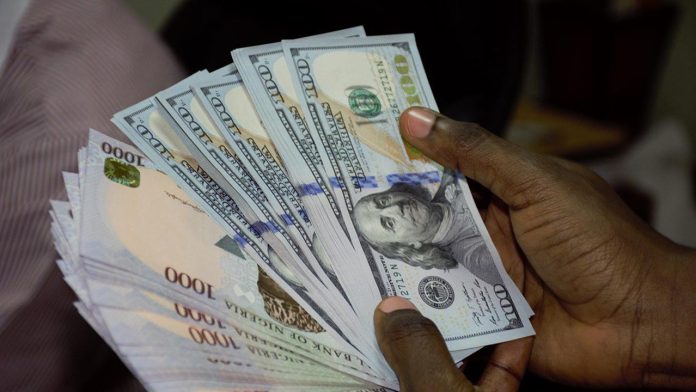 Naira gains 0.61% to ₦1,607.15 per Dollar amid decline in daily turnover