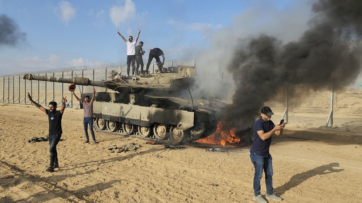 Palestinians capture an Israeli tank during al aqsa storm opration on October 7